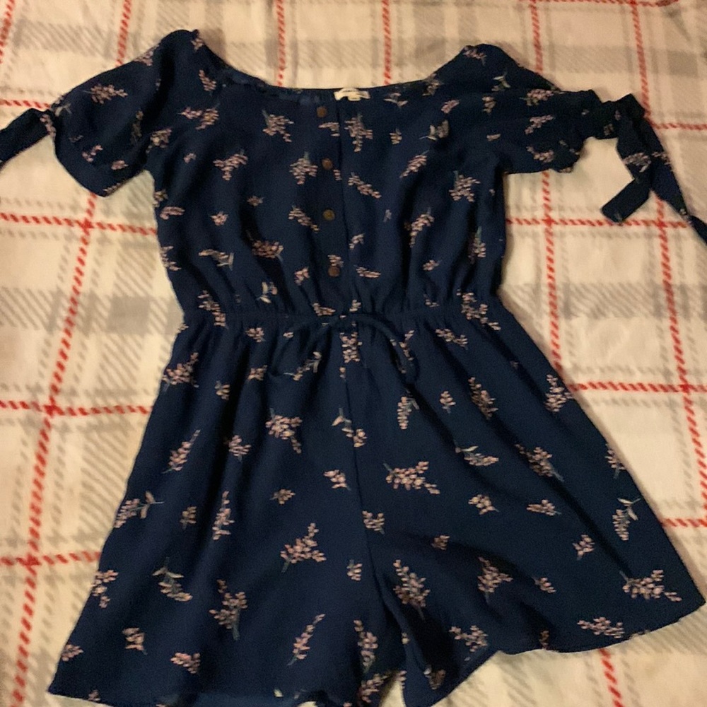 Girls size large jump suit. Navy with flowers.